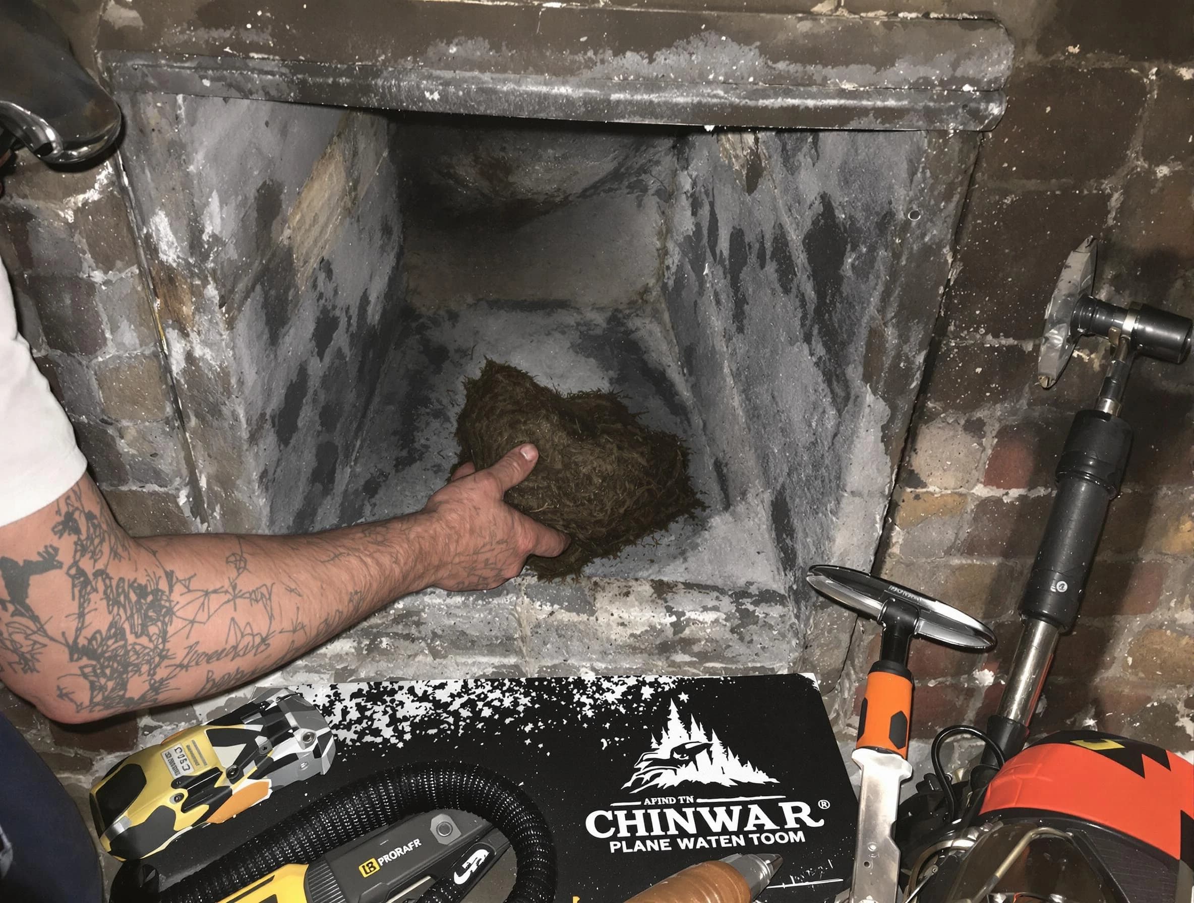 Leeds Chimney Sweep safely removing debris and screening chimney in Leeds, AL
